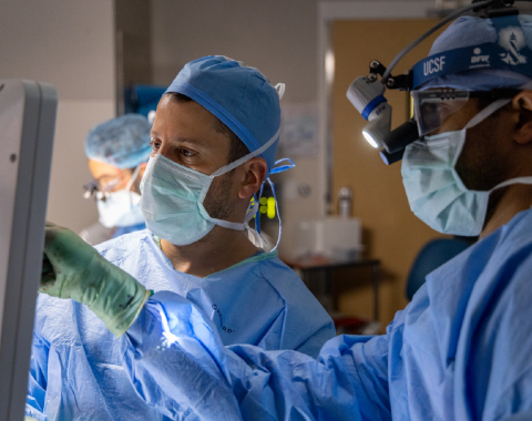 Eze Goldschmidt, MD, PhD in the operating room with Kunal Raygor, MD